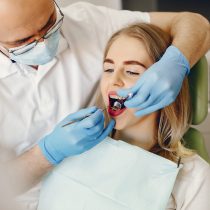 Beautiful lady in the dentist's office. Woman in a uniform